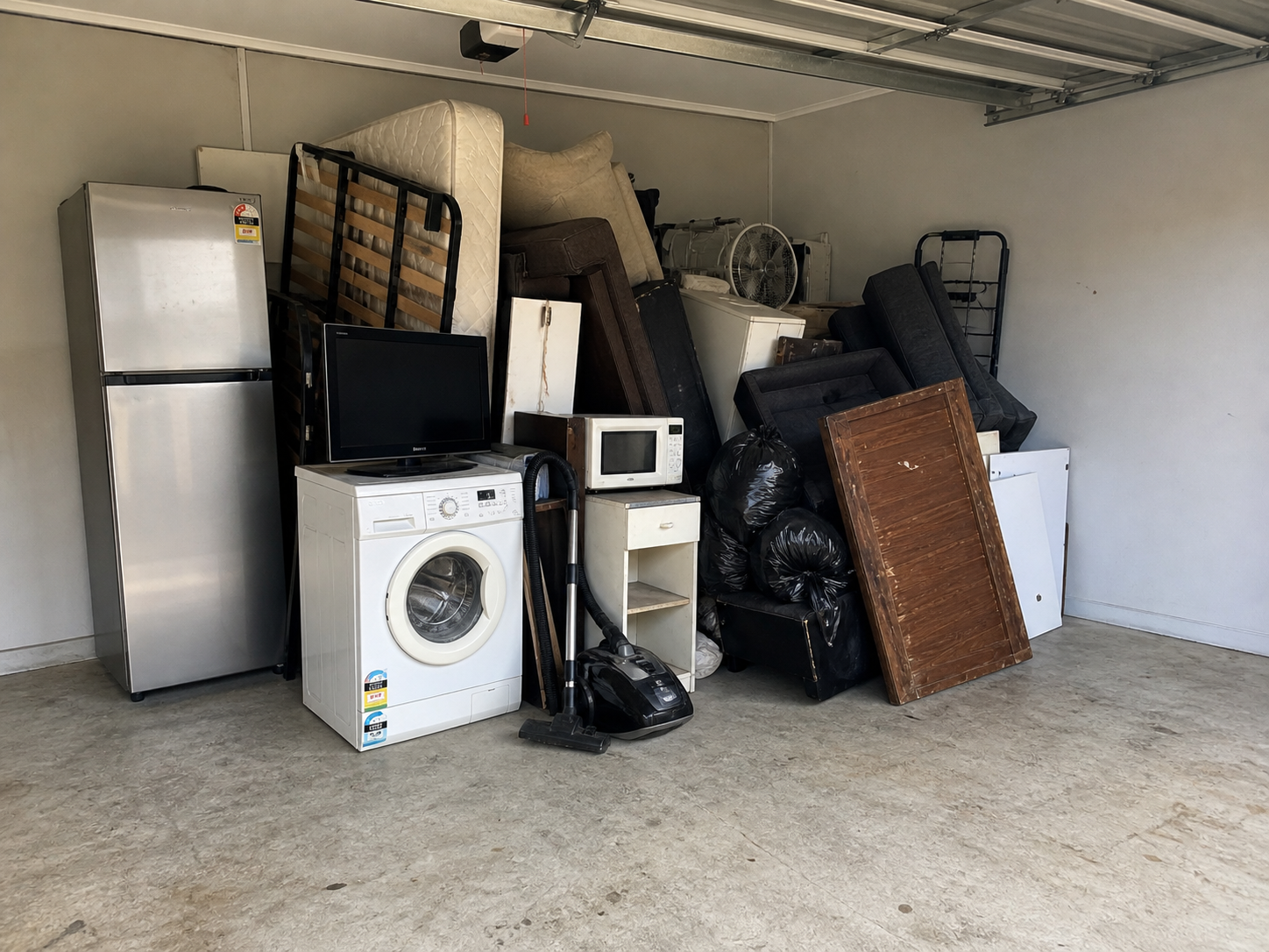 Perth garage filled with household junk before rubbish removal