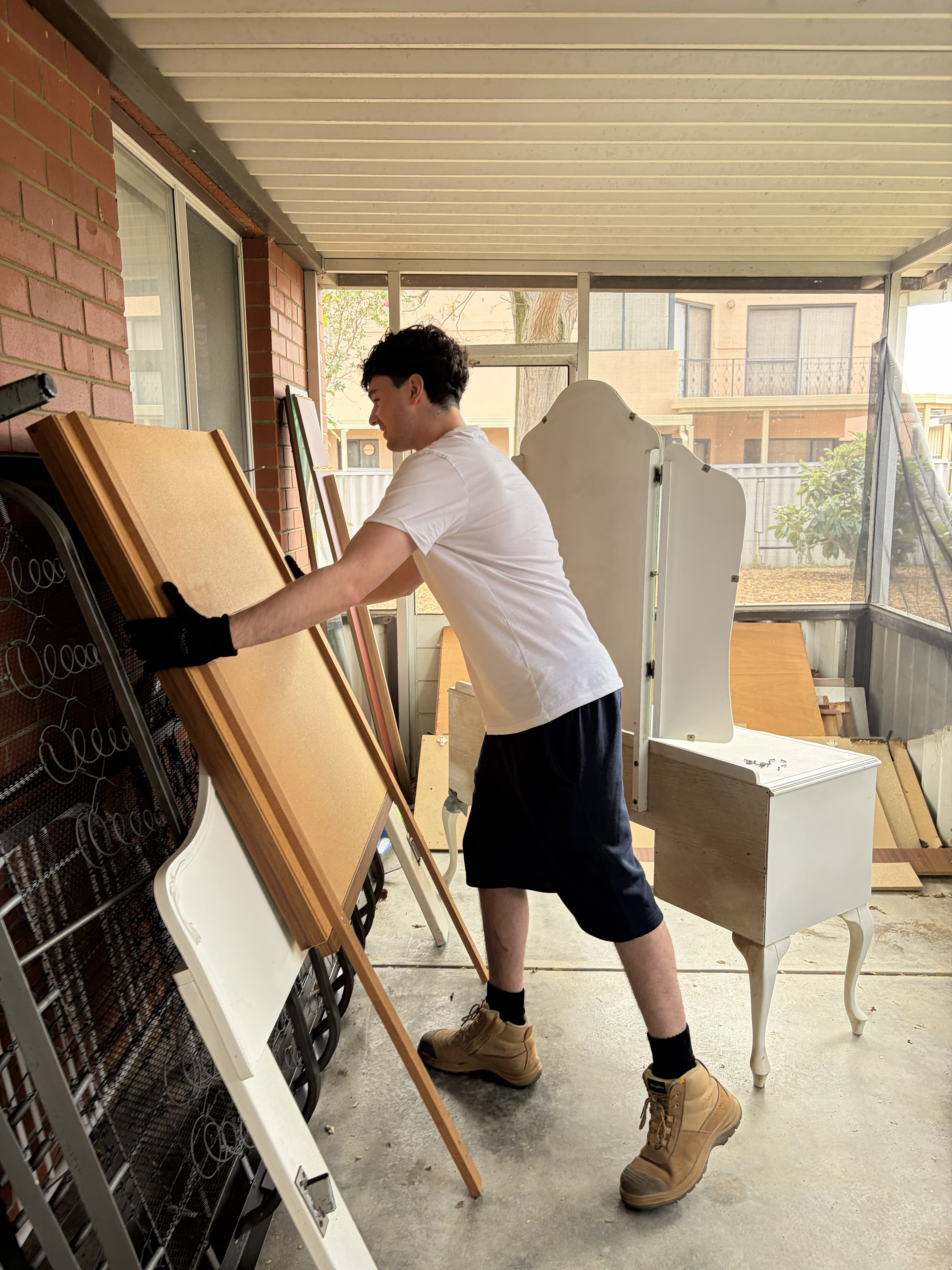 Local Perth removalist team member handling furniture removal professionally